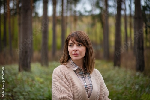 Woman in Forest, Pensive Woman Outdoors, Nature Background, Brown Hair, Plaid Shirt, Autumn Scene Image