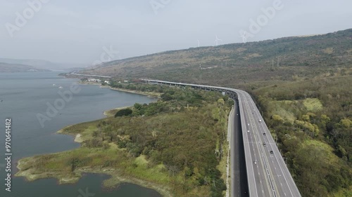 The M6  motorway Expressway Nakhon Ratchasima Province - Bang Pa-in. Lam Ta Khong River and Mountain. Drone shot of scenic landscape rural place traffic. Nakhon Ratchasima Thailand. Motorway Korat
 photo