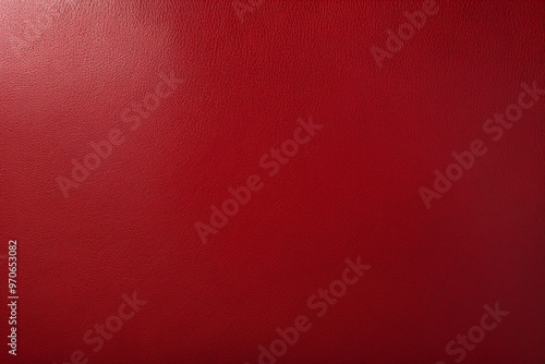 Abstract background of rich red leather with a glossy finish and subtle texture.