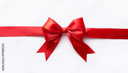 Red satin ribbon with bow on white background, top view