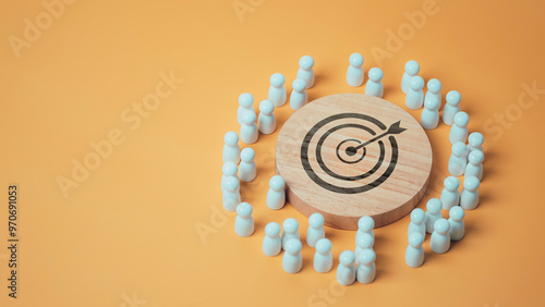 Obraz na płótnie Target concept of business and personnel in a company. wooden dolls standing around icon arrows for creating and targeting business objectives. Marketing solutions, targets for business w salonie