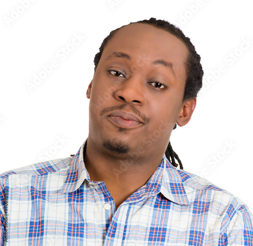 portrait of an arrogant young man in shirt who thinks highly of himself photo