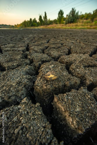 Half-dried lake b legacy of global warming summer b hot days in the summer dried up the lake. Cracked earth around the lake. The water level in the lake dropped to impressive proportions