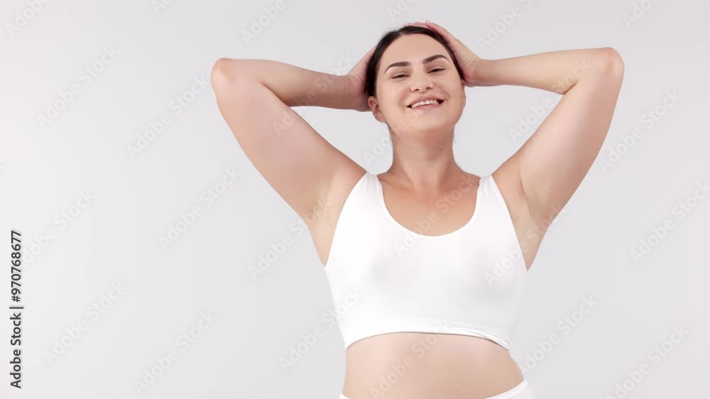 Attractive and cheerful woman dancing on a white background. Perfect for promoting body positivity, fitness, and weight loss, inspiring an active and healthy lifestyle. Attractive and cheerful woman dancing on a white background. Perfect for promoting body positivity, fitness, and weight loss, inspiring an active and healthy lifestyle.