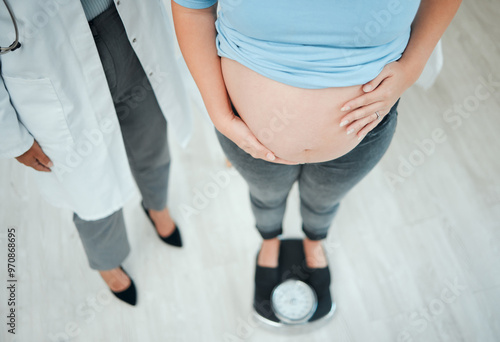 Hospital, weigh and doctor with pregnant woman for consulting, wellness or prenatal appointment in clinic. Healthcare, gynecologist and patient on scale for medical service, growth progress or weight
