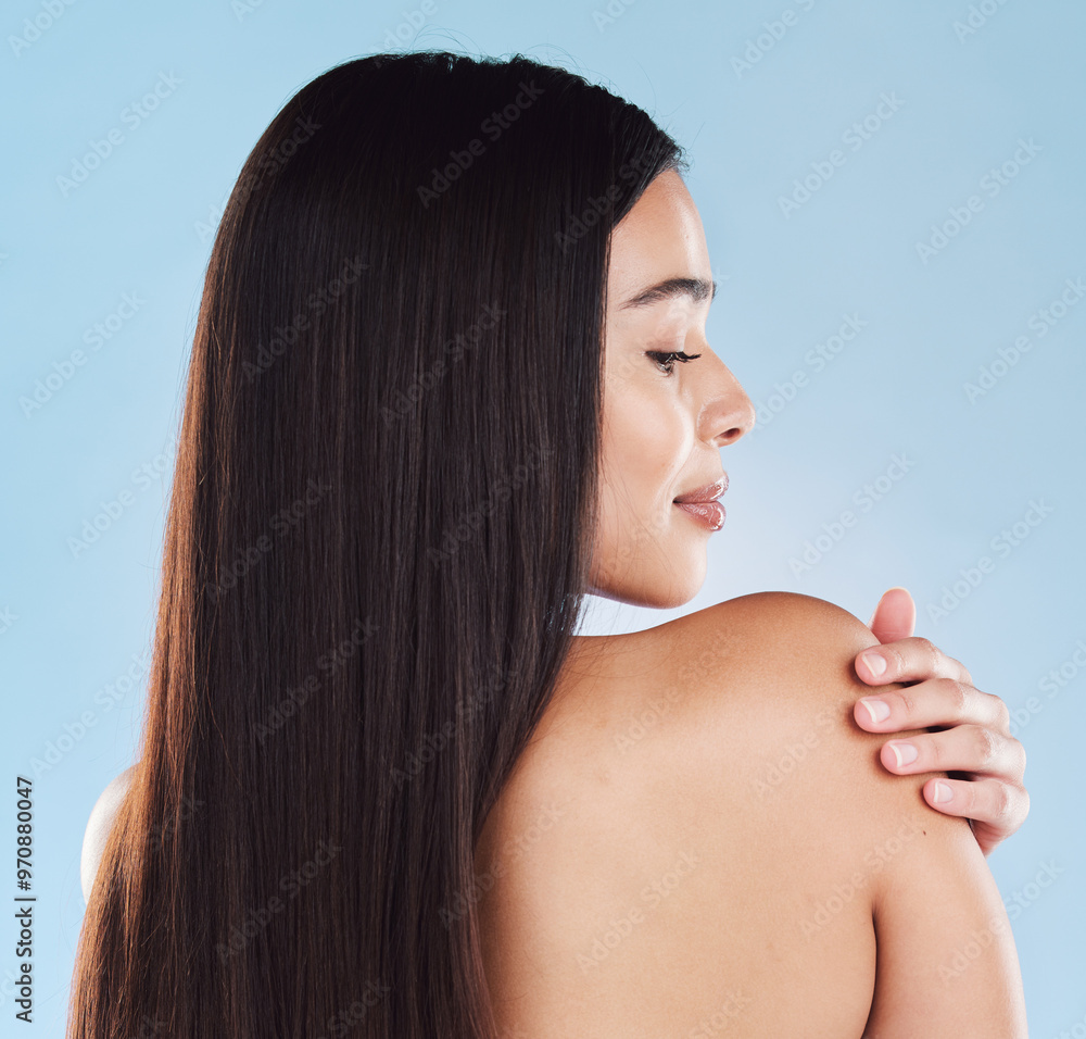 Naklejka premium Beauty, hair and back of woman in studio for salon, wellness and keratin treatment for texture. Hairdresser, spa aesthetic and isolated person with shine, cosmetics and health on blue background