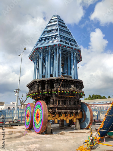 A temple chariot, also called a ratha or ther, is a large, intricately decorated wooden vehicle used in Hindu temple festivals. It plays a key role in the Brahmotsavam festival at Venkateswara Temple  photo