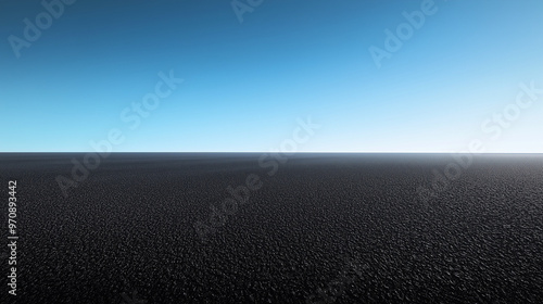 Smooth Black Sand Desert Plateau with Reflective Ground and Deep Blue Sky, Minimalistic Landscape Captured from Wide Low-Angle View in High Contrast