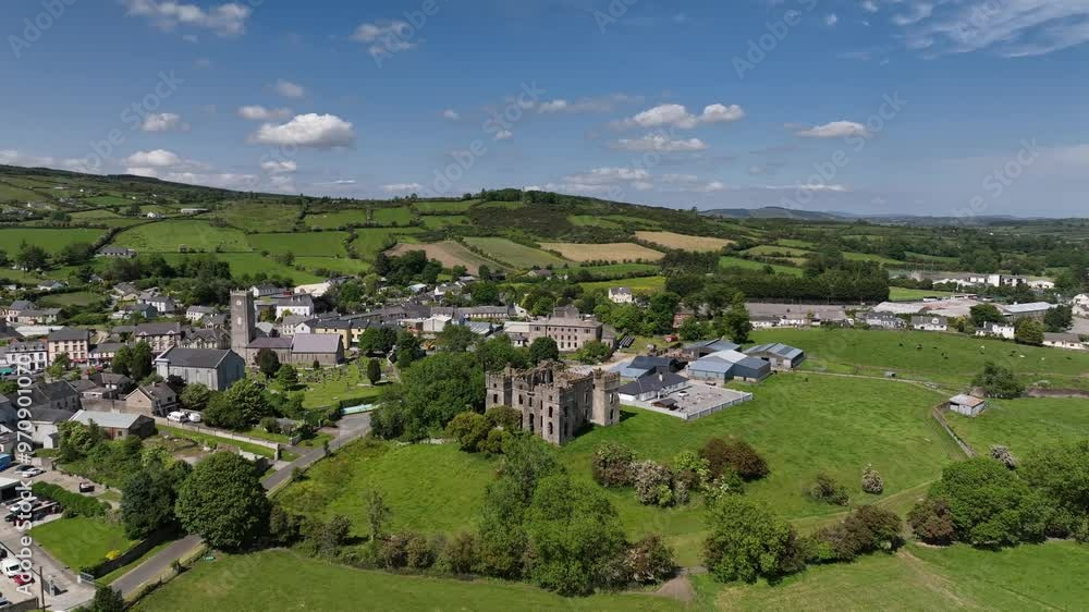 Raphoe Castle, County Donegal, Ireland, June 2023. Drone orbits clockwise around the ruined Bishop's Palace outside the town surrounded by lush green fields and trees with hills in distance. Raphoe Castle, County Donegal, Ireland, June 2023. Drone orbits clockwise around the ruined Bishop's Palace outside the town surrounded by lush green fields and trees with hills in distance.