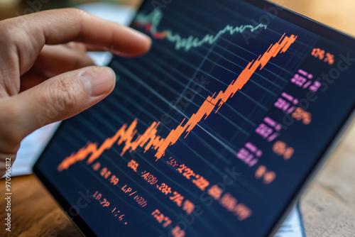 A hand is pointing at rising stock market chart, indicating positive trends and growth in financial data. vibrant colors of graph reflect sense of optimism and success in investments