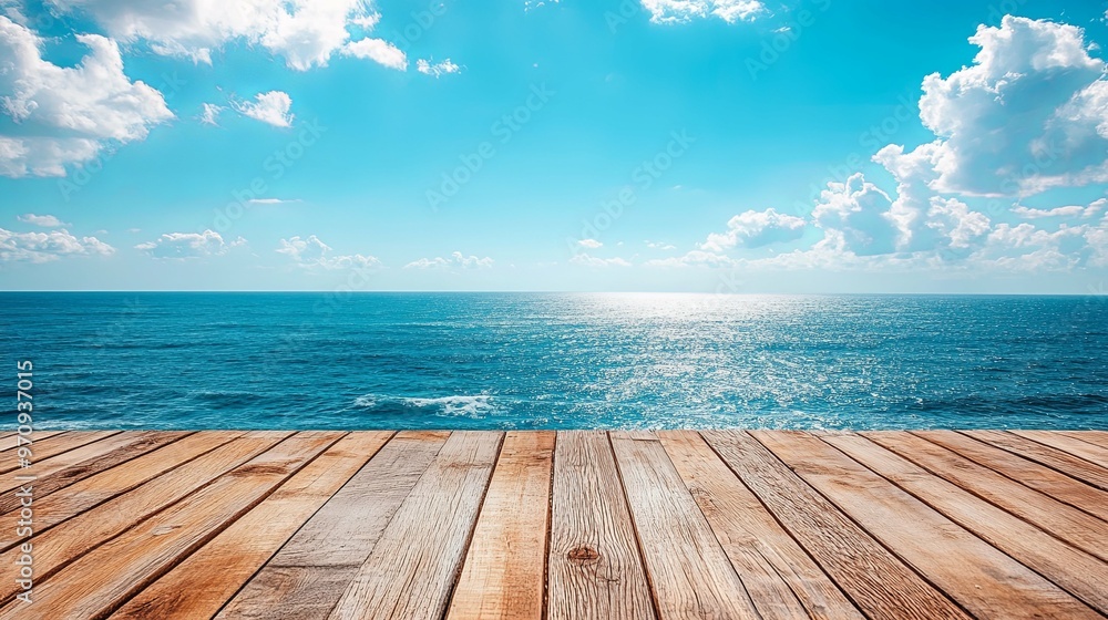 Wooden Deck Overlooking a Blue Ocean with White Clouds and Sun Glare Wooden Deck Overlooking a Blue Ocean with White Clouds and Sun Glare