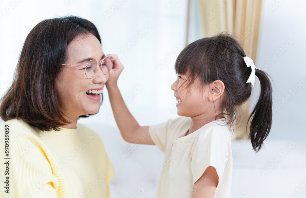 Child playing with mother in room, Asian mother enjoying with daughter at home Child playing with mother in room, Asian mother enjoying with daughter at home