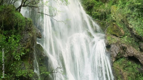 The Cascade d'Autoire waterfall in summer. A 30 meter high waterfall near Autoire in Lot Occitanie Southern France photo