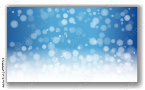 Abstract image displaying a blue and white bokeh light effect on a gradient background. The blurred circles create a soft and dreamy atmosphere. Concept of festive or magical ambiance