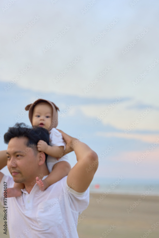 a man carrying a child on his shoulders a man carrying a child on his shoulders