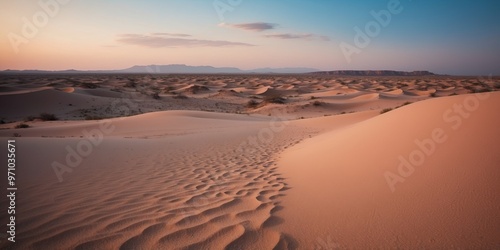 Fototapeta Naklejka Na Ścianę i Meble -  A vast desert landscape with pink sand dunes under a blue sky with fluffy white clouds.