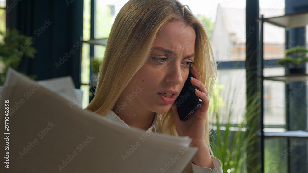 Fototapeta premium Caucasian businesswoman talk mobile phone arguing negative emotion dissatisfied wrong business contract financial report documents mistake stressed angry entrepreneur girl woman call smartphone shout
