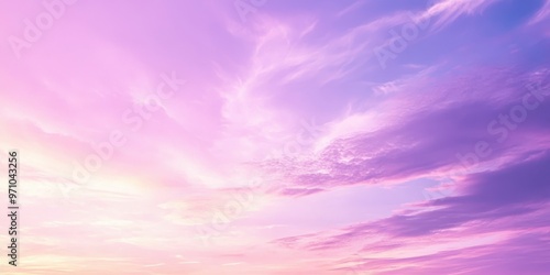 A serene sunrise sky with soft pastel colors blending together, creating a peaceful and tranquil atmosphere.