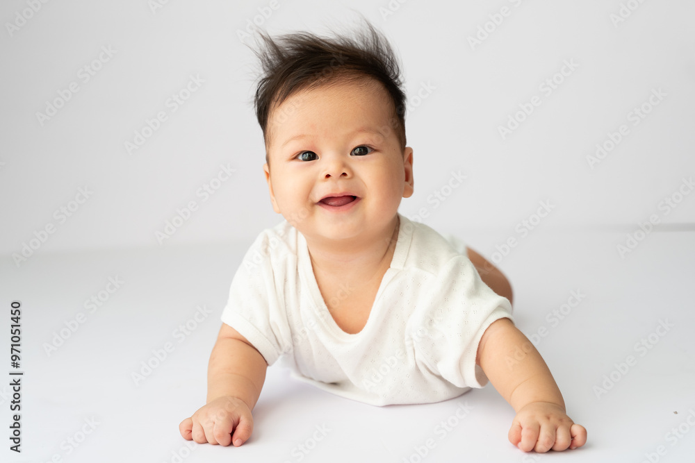 a baby is laying down on the floor a baby is laying down on the floor