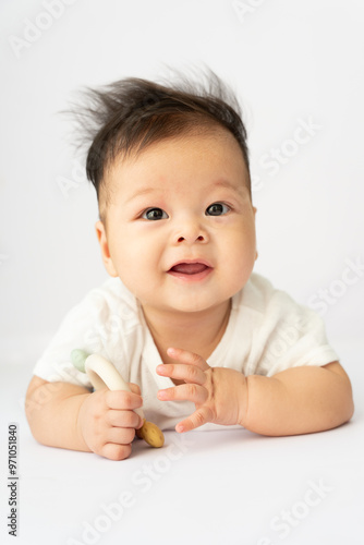 a baby is laying on the floor and looking up at the camera