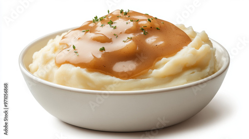 A bowl of mashed potatoes with gravy on top