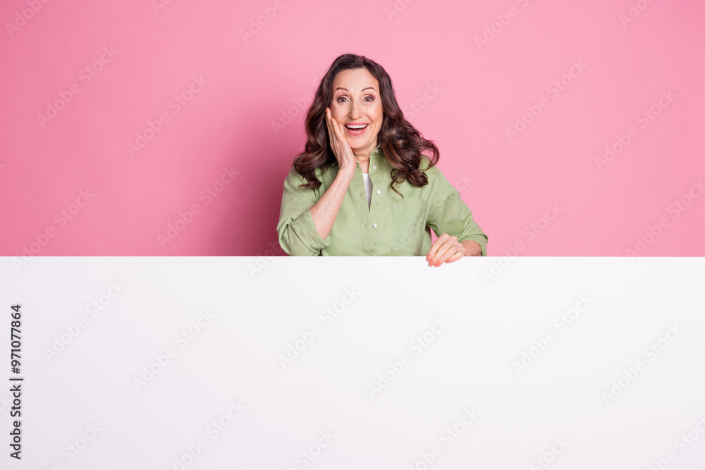Photo of retired grandmother touch cheek when see proposition whiteboard marketing promo isolated on pink color background Photo of retired grandmother touch cheek when see proposition whiteboard marketing promo isolated on pink color background