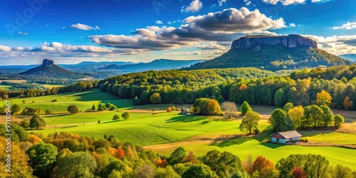 Scenic rural landscape with rolling hills and vast blue sky near Pilot Mountain in Surry County, North Carolina, showcasing serene countryside atmosphere.