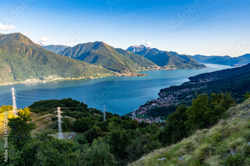 View of Lake Como, towards the south, from Musso, with the overhanging mountains, Dervio, the roads and the towns bordering the lake.
 photo