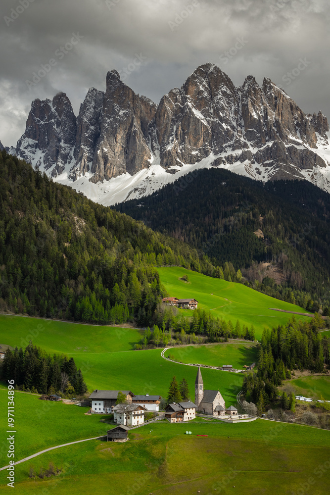Spring views in Dolomites in Italy. In the picture Santa Maddalena di Funes with Odle mountains.