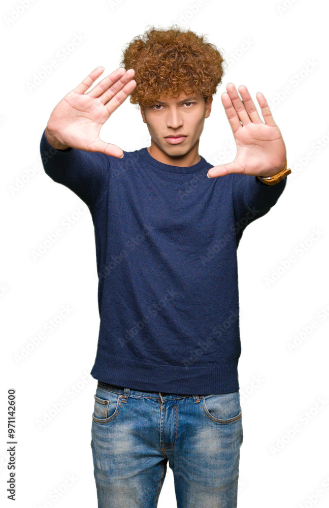 Young handsome man with afro hair Smiling doing frame using hands palms and fingers, camera perspective Young handsome man with afro hair Smiling doing frame using hands palms and fingers, camera perspective