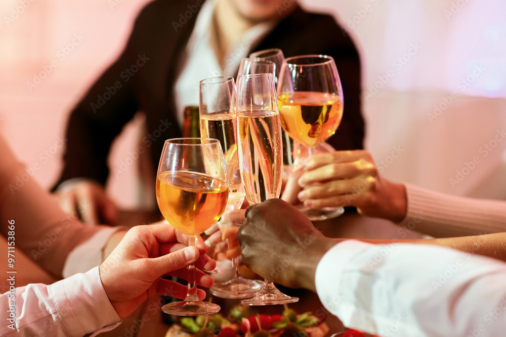 Christmas Eve. Cheerful Young People Having Xmas Dinner Party, Toasting Clinking Glasses Sitting At Home. Selective Focus Christmas Eve. Cheerful Young People Having Xmas Dinner Party, Toasting Clinking Glasses Sitting At Home. Selective Focus