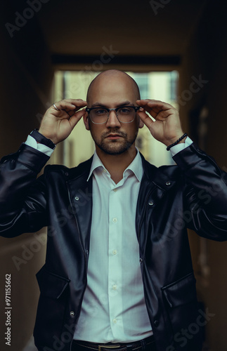 Young beard man posing in the street, fashion beard man portrait, tattoo hand, Handsome, happy face, street photo, hipster style portrait, tattoo, leather jacker, glasses, watch, brutal man, photo