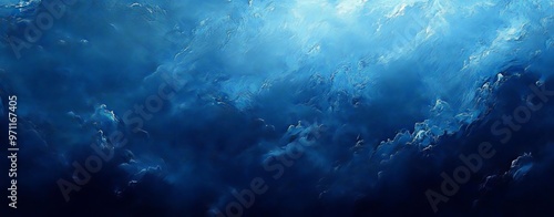 Deep blue and black abstract texture with misty overlays, capturing the depth and mystery of the ocean or a night sky The image should be rich and atmospheric photo