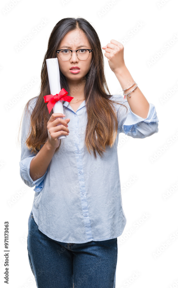 Young asian woman holding degree over isolated background annoyed and frustrated shouting with anger, crazy and yelling with raised hand, anger concept Young asian woman holding degree over isolated background annoyed and frustrated shouting with anger, crazy and yelling with raised hand, anger concept