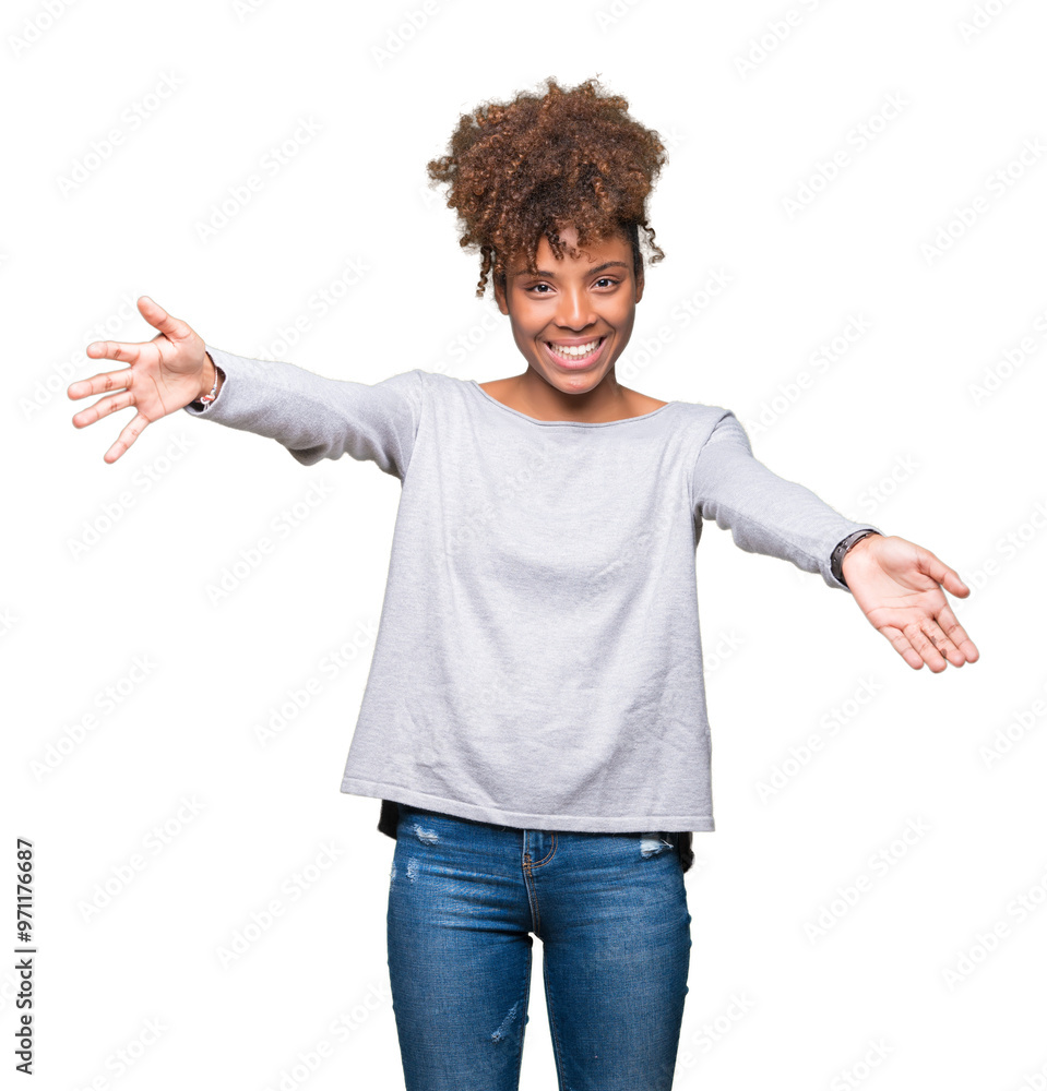 Beautiful young african american woman over isolated background looking at the camera smiling with open arms for hug. Cheerful expression embracing happiness. Beautiful young african american woman over isolated background looking at the camera smiling with open arms for hug. Cheerful expression embracing happiness.