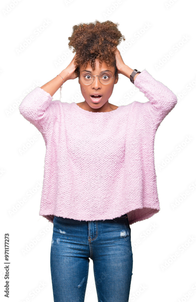 Beautiful young african american woman wearing glasses over isolated background Crazy and scared with hands on head, afraid and surprised of shock with open mouth Beautiful young african american woman wearing glasses over isolated background Crazy and scared with hands on head, afraid and surprised of shock with open mouth