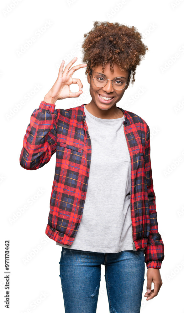Beautiful young african american woman wearing glasses over isolated background smiling positive doing ok sign with hand and fingers. Successful expression. Beautiful young african american woman wearing glasses over isolated background smiling positive doing ok sign with hand and fingers. Successful expression.