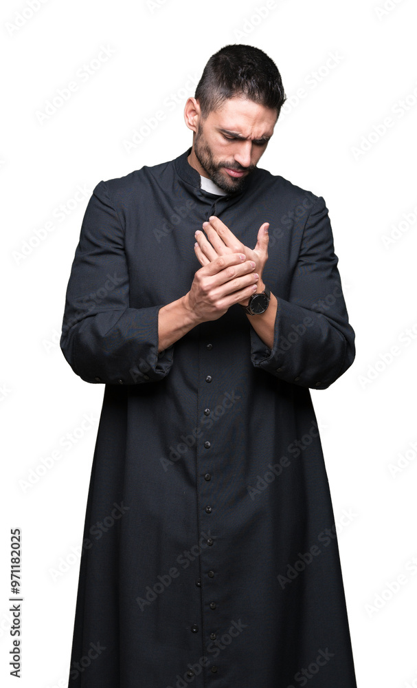 Young Christian priest over isolated background Suffering pain on hands and fingers, arthritis inflammation Young Christian priest over isolated background Suffering pain on hands and fingers, arthritis inflammation