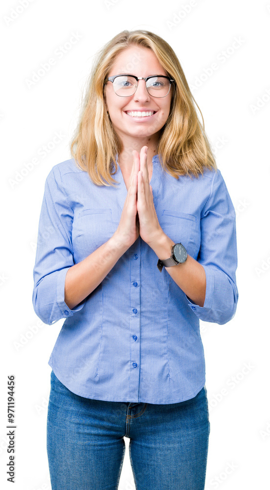 Beautiful young business woman over isolated background praying with hands together asking for forgiveness smiling confident. Beautiful young business woman over isolated background praying with hands together asking for forgiveness smiling confident.