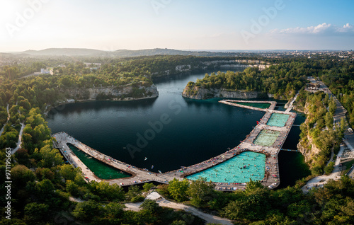Sunset over Zakrzowek - deep lake with swimming pool in old quarry, Krakow, Poland