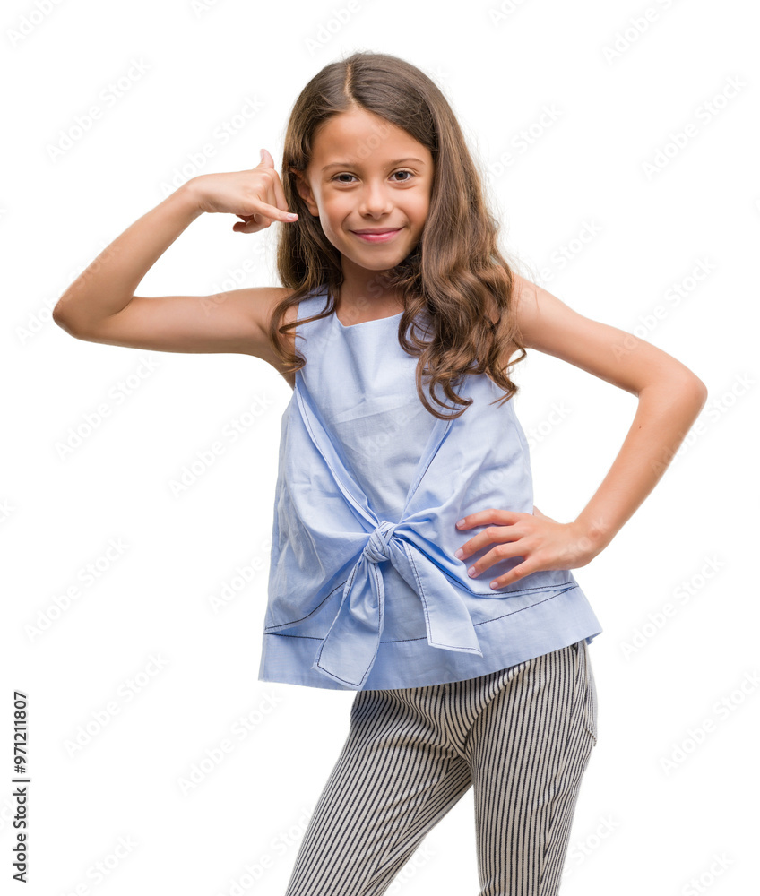 Brunette hispanic girl smiling doing phone gesture with hand and fingers like talking on the telephone. Communicating concepts. Brunette hispanic girl smiling doing phone gesture with hand and fingers like talking on the telephone. Communicating concepts.
