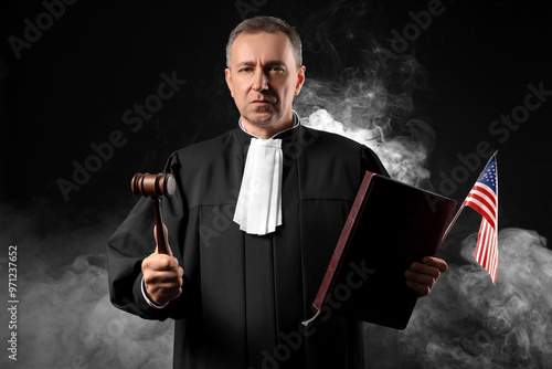 Mature judge with gavel and...