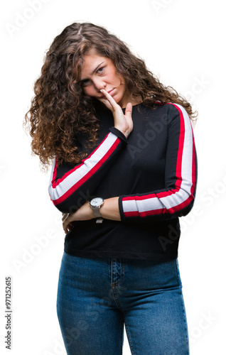 Beautiful young brunette curly hair girl wearing casual look over isolated background thinking looking tired and bored with depression problems with crossed arms.