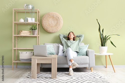 Pretty young woman sitting ...