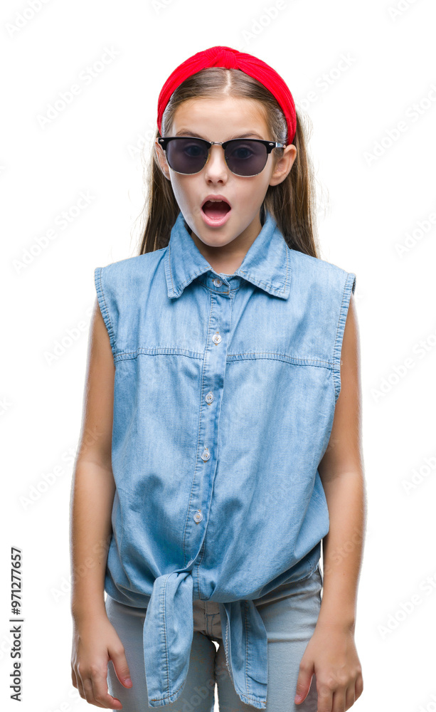 Young beautiful girl wearing sunglasses over isolated background afraid and shocked with surprise expression, fear and excited face. Young beautiful girl wearing sunglasses over isolated background afraid and shocked with surprise expression, fear and excited face.