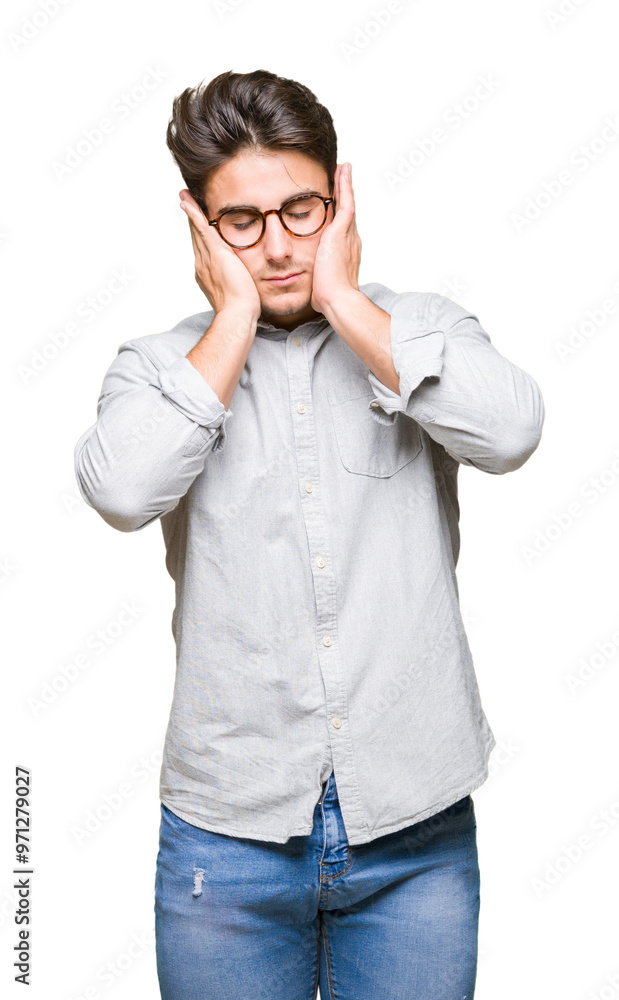 Young handsome man wearing glasses over isolated background with hand on head for pain in head because stress. Suffering migraine. Young handsome man wearing glasses over isolated background with hand on head for pain in head because stress. Suffering migraine.