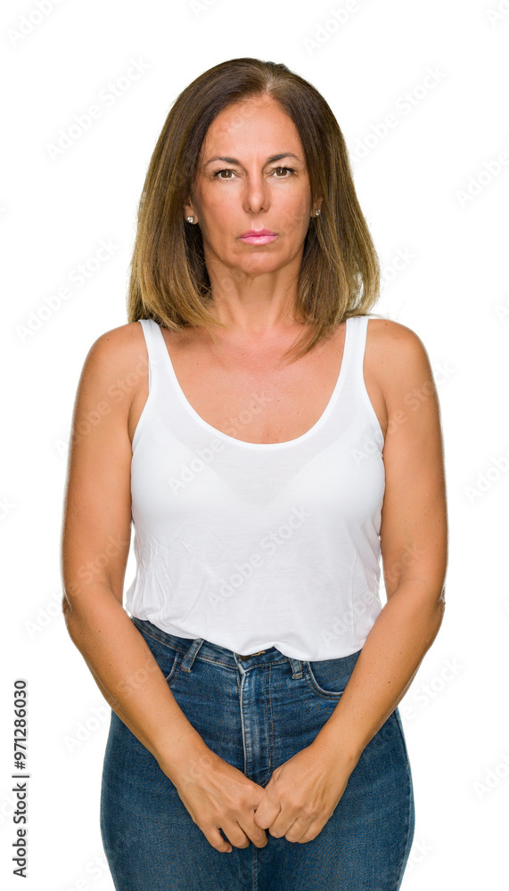 Beautiful middle age casual adult woman over isolated background with serious expression on face. Simple and natural looking at the camera. Beautiful middle age casual adult woman over isolated background with serious expression on face. Simple and natural looking at the camera.