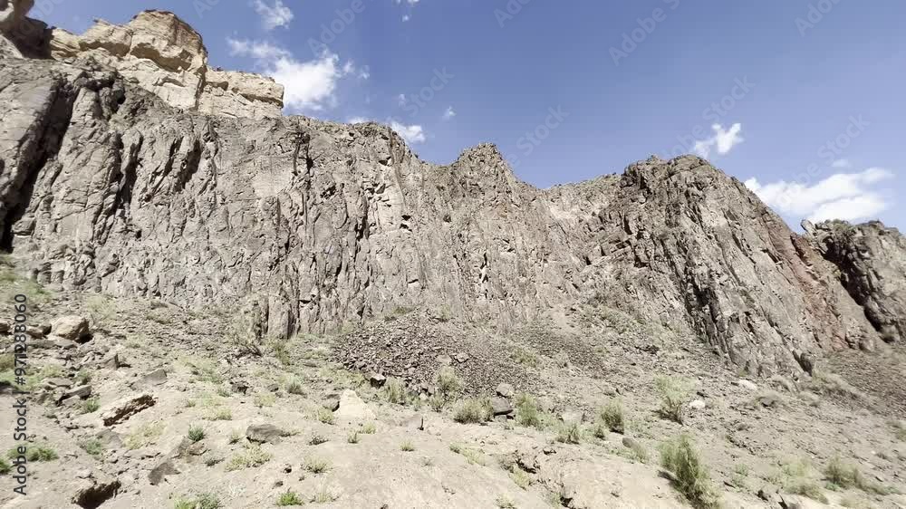 Panorama of the yellow cliffs of the canyon in sunny weather against the blue sky. Panorama of the yellow cliffs of the canyon in sunny weather against the blue sky.