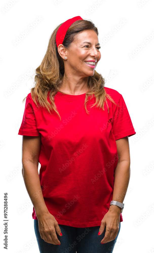 Middle age senior hispanic woman over isolated background looking away to side with smile on face, natural expression. Laughing confident. Middle age senior hispanic woman over isolated background looking away to side with smile on face, natural expression. Laughing confident.