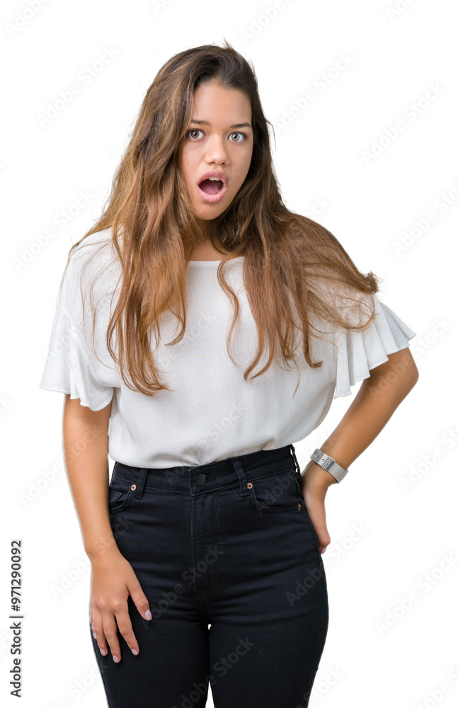 Young beautiful brunette business woman over isolated background afraid and shocked with surprise expression, fear and excited face. Young beautiful brunette business woman over isolated background afraid and shocked with surprise expression, fear and excited face.